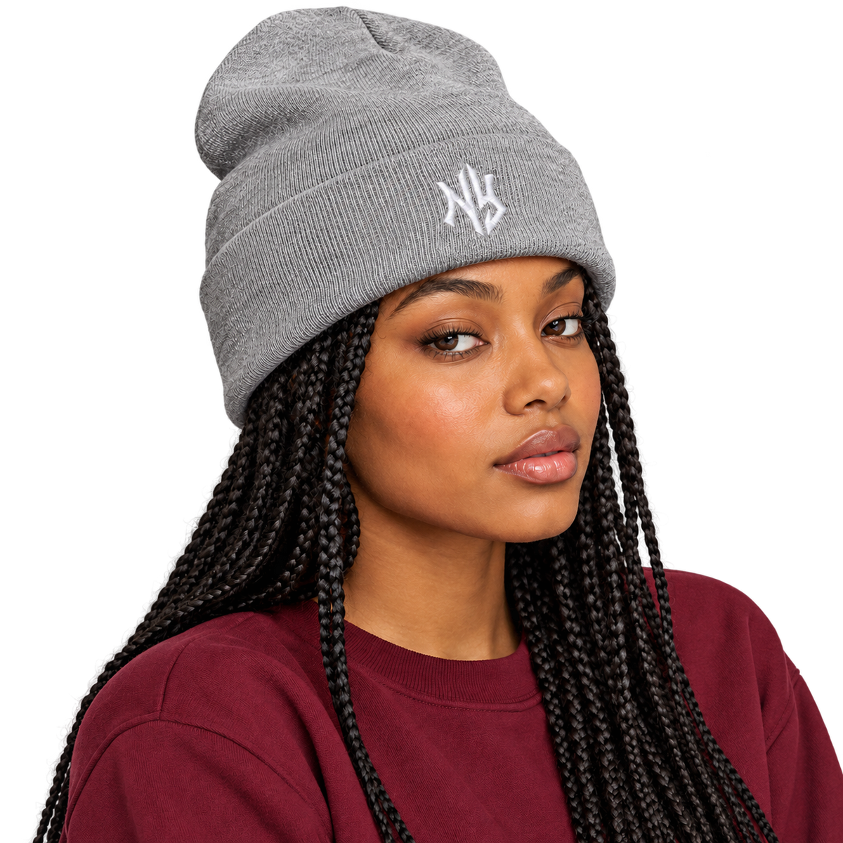 Female model wearing NY Cuffed Beanie in Heather Grey