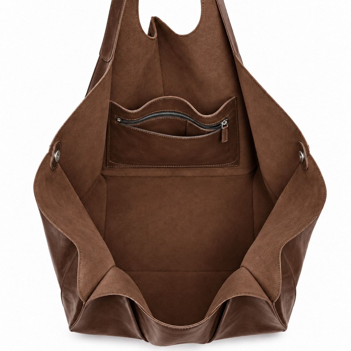 Empty interior of oversized brown tote bag showing pockets