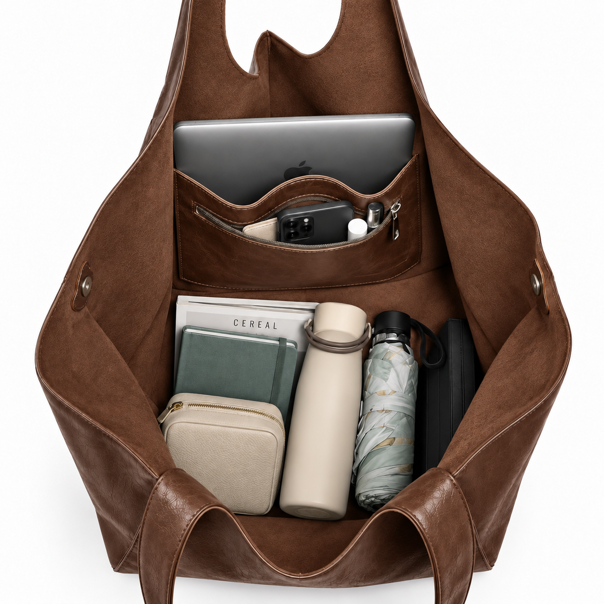 Oversized brown tote bag filled with laptop and everyday essentials