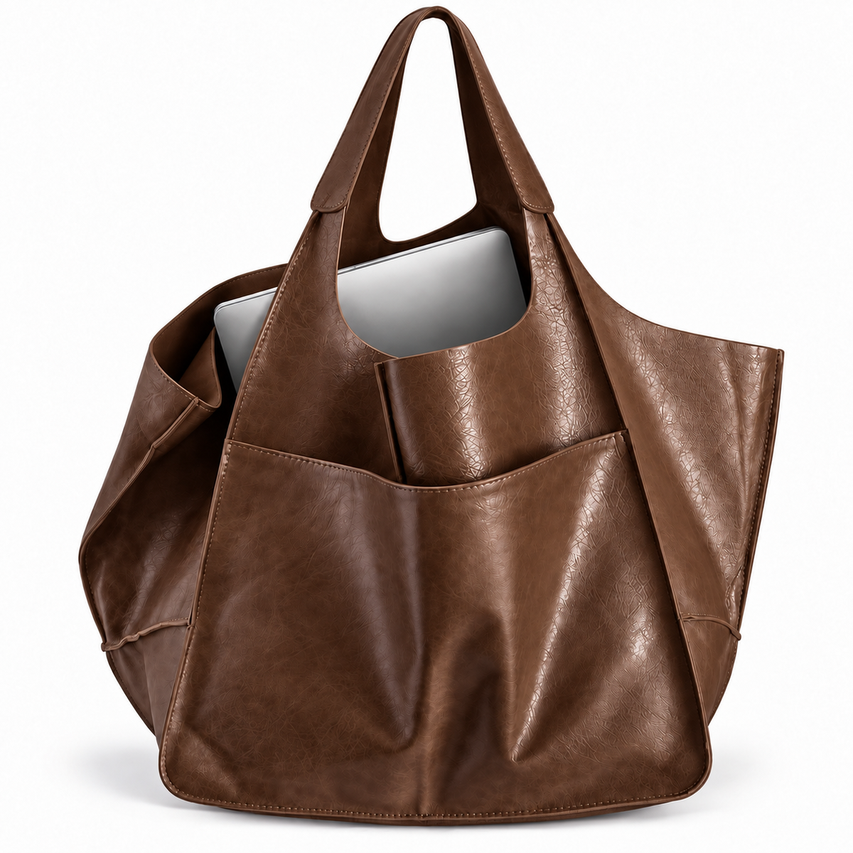 Brown oversized tote bag showing a laptop fitting inside
