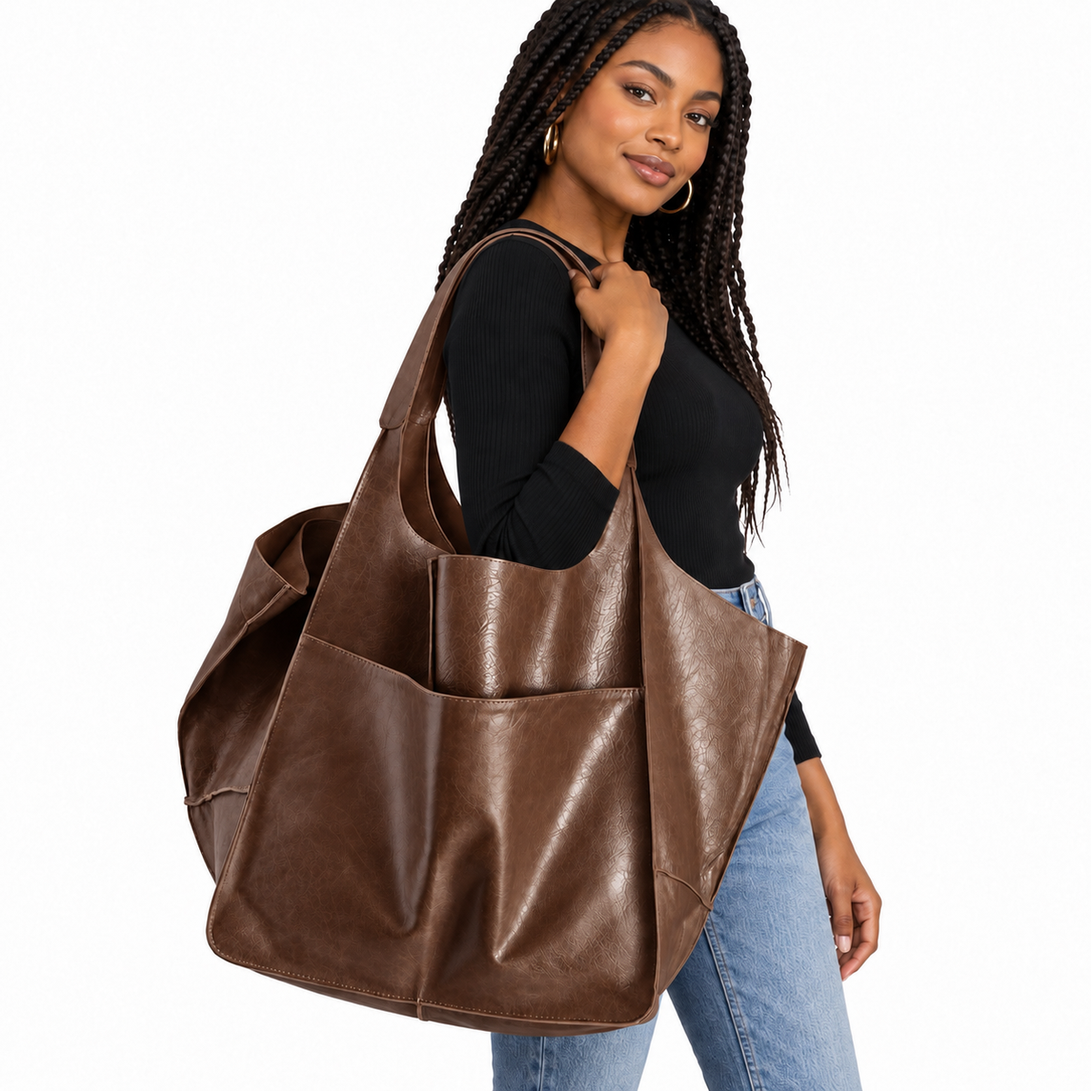 Black woman carrying oversized brown slouchy tote bag