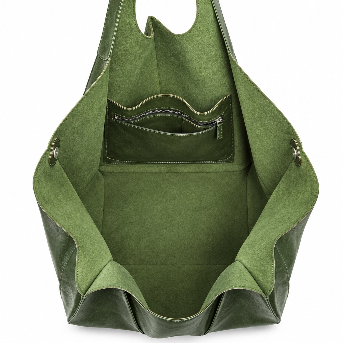 Empty interior of oversized green tote bag showing pockets