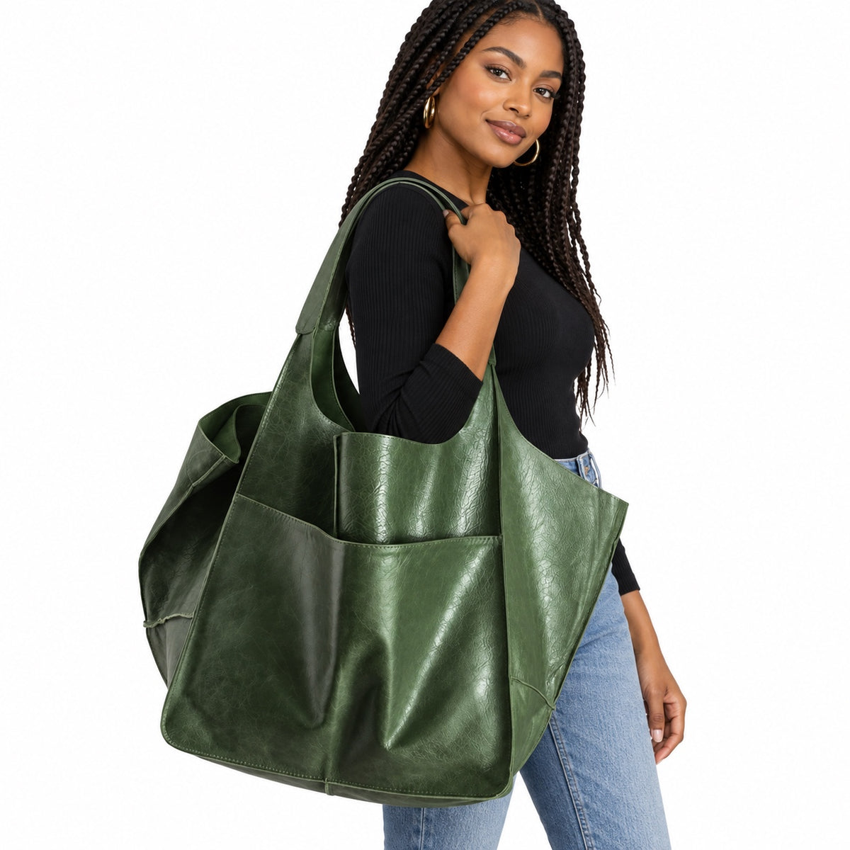 Black woman carrying oversized green slouchy tote bag