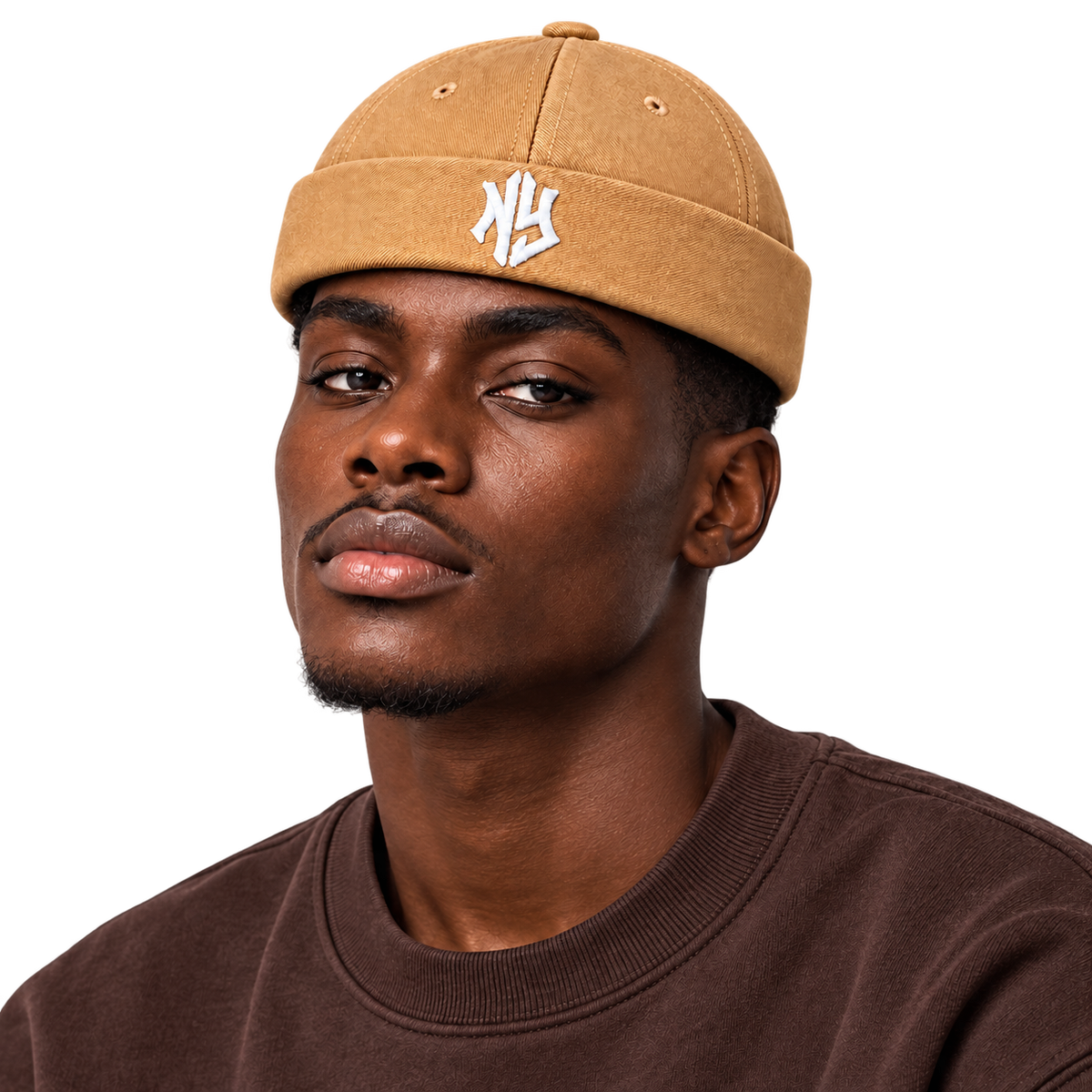 Male model wearing NY Brimless Hat in Tan